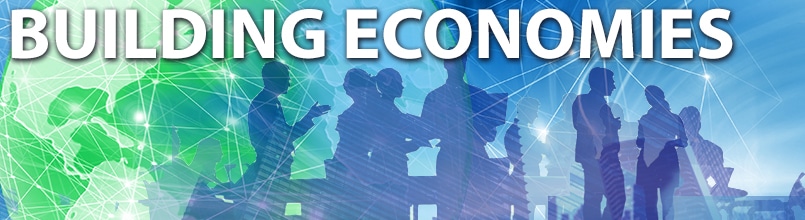 Illustration of business people meeting with a drawing of NAFTA countries in the background is labeled “Building Economies.”