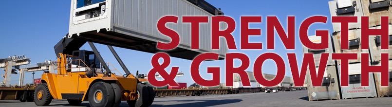 The words “Strength & Growth” are printed over a picture of a port of entry.