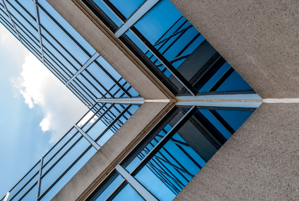 Abstract,Image,Of,Looking,Up,At,Modern,Glass,And,Concrete